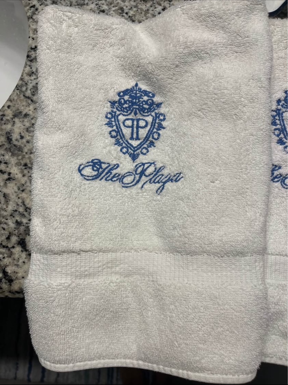 Embroidered White Guest Towel with Blue Crest